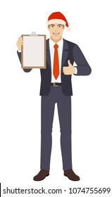Businessman in Santa hat holding the clipboard and showing thumb up. Full length portrait of businessman in a flat style. Vector illustration.