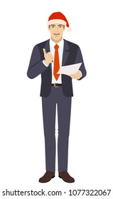 Businessman in Santa hat  holding a pen and paper. Full length portrait of businessman in a flat style. Vector illustration.