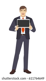 Businessman showing blank digital tablet PC. Full length portrait of businessman in a flat style. Vector illustration.