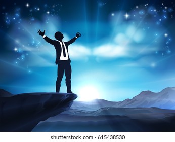 A businessman in silhouette on a cliff top with arms raised. A concept for being successful or achieving an ambition