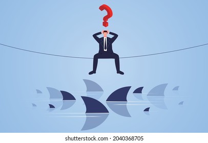 The businessman sits restlessly on the rope between the shark groups, troubles and desperate emotions.