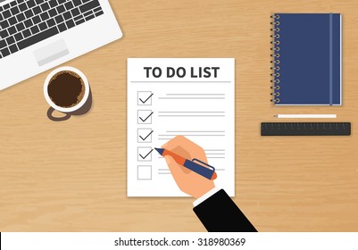 Businessman sitting at his desktop and fulfilling his work checklist