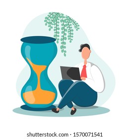 Businessman sitting near the hourglass with laptop legs crossed. Business concept of time management and procrastination.