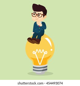 businessman sitting on the idea lightbulb