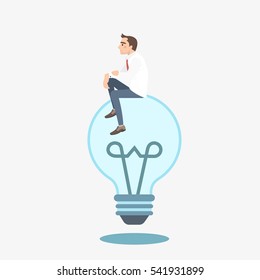 Businessman sitting on a not lit idea light bulb hatching an idea. Business thinking metaphor.