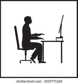 Businessman sitting on office chair at table and working on computer. Side view. Vector silhouette. Man typing in office at desk and staring into monitor