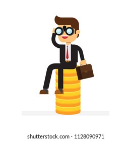 businessman sitting on stack of gold coins