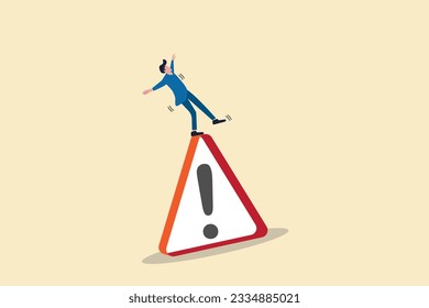 Businessman slip falling on caution sign. concept of business risk, problem warning and avoid danger