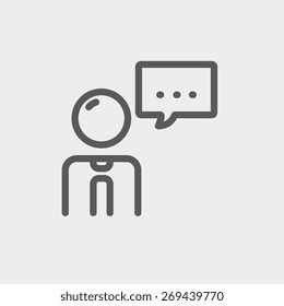 Businessman with speech bubble icon thin line for web and mobile, modern minimalistic flat design. Vector dark grey icon on light grey background.