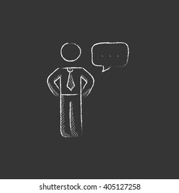 Businessman with a speech square. Drawn in chalk icon.