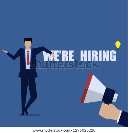 Businessman stand behind text we are hiring and megaphone.