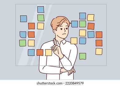 Businessman stand near board brainstorm work with sticky notes. Male employee engaged in creative thinking in office. Vector illustration. 