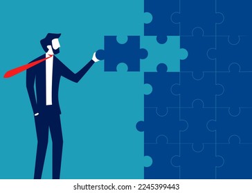 Businessman standing assembling jigsaw puzzle. business solution concept