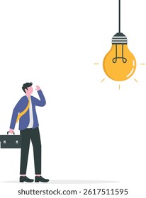 Businessman standing below light bulb. Looking for creativity concept