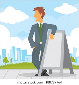 Businessman standing beside a blank banner ad