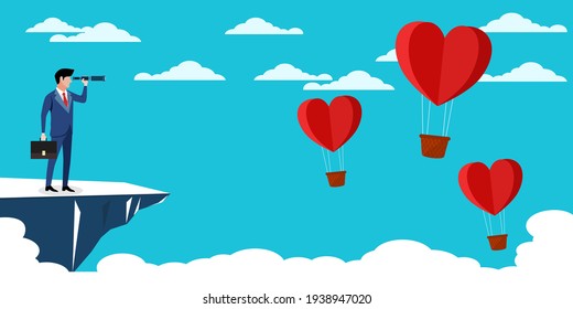 A businessman standing with a camera looking for a heart shaped balloon. Business vision