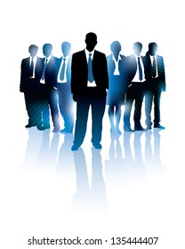 Businessman is standing in front of a group of people.