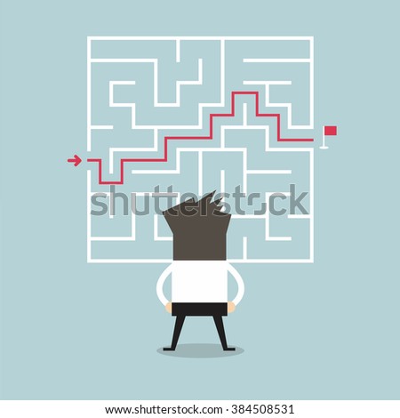 Businessman standing in front of a maze with a solution to success