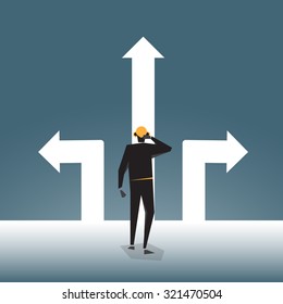 Businessman standing in front of three arrows.
