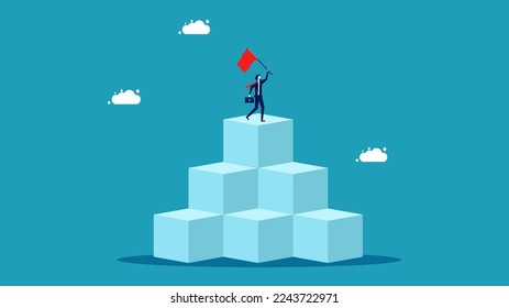 Businessman standing holding victory flag on top floor. concept of business victory