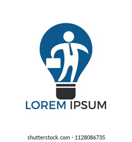 Businessman standing inside a light bulb logo design. business concept. Technology idea concept illustration.