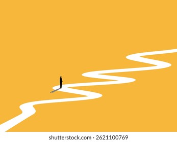 Businessman standing in the middle of a winding path