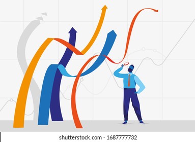 Businessman standing near growing graphs lines and looking at them through the magnifying glass