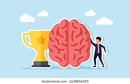 Businessman standing next to brain and trophy illustration of champion mindset or critical and creative thinking