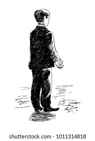 Businessman standing on the beach. Meditation