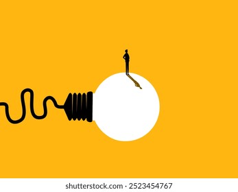 Businessman standing on creative light bulb 