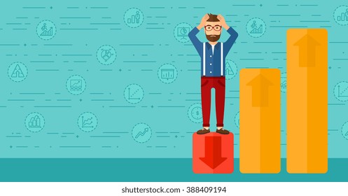 Businessman standing on low graph.