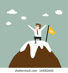 Businessman standing on a peak