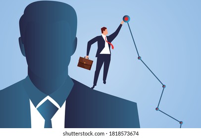 Businessman standing on the shoulders of giants and touching the highest target point