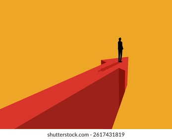 Businessman standing on the tip of an arrow pointing in the direction of growth