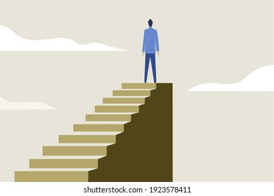 A businessman standing on the top after climbing the steps