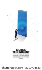 businessman standing and point to screen of  big mobile phone. Business Concept of mobile technology with business.