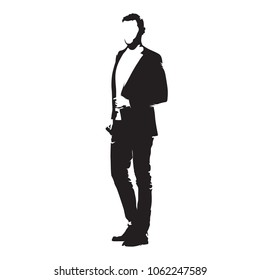 Businessman standing in suit, isolated vector silhouette. Side view