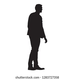 Businessman standing in suit, isolated vector silhouette, side view, profile