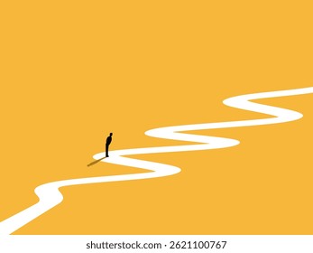 Businessman standing thinking in the middle of a long winding path
