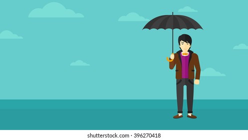 Businessman standing with umbrella.