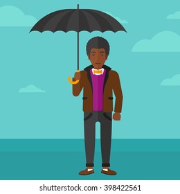 Businessman standing with umbrella.