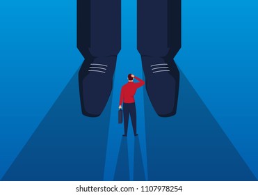 Businessman stands at the feet of giants