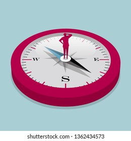 Businessman stands on the compass. Isolated on blue background.