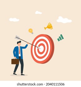 Businessman sticks an arrow at a big target. Goal achievement. Man hit the target exactly. Vector illustration