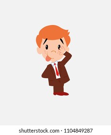 Businessman sticks out his tongue in gesture of funny shyness.