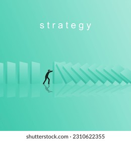 Businessman is stopping a falling domino. A symbol of the crisis and risks that are occurring and how to deal with them. Leadership concept and commitment to drive the organization through the crisis.