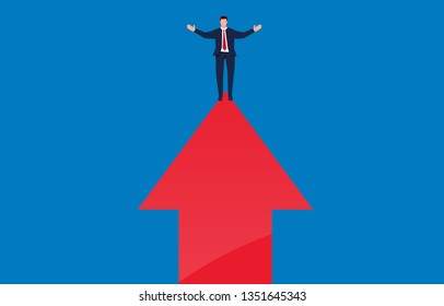 Businessman stretches out his arms and stands at the top of the arrow