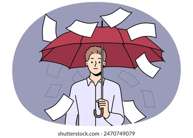 Businessman suffering from bureaucracy standing with umbrella among falling documents symbolizing overabundance of paperwork. Business concept of inefficiency in corporation due to bureaucracy