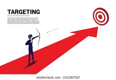 Businessman in suit shoot the arrow to target . Business Concept of marketing target and customer.