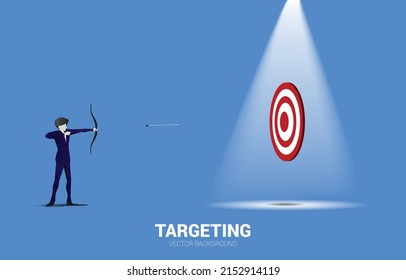 Businessman in suit shoot the arrow to target . Business Concept of marketing target and customer.